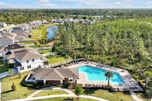 an aerial view of a house with a ocean view