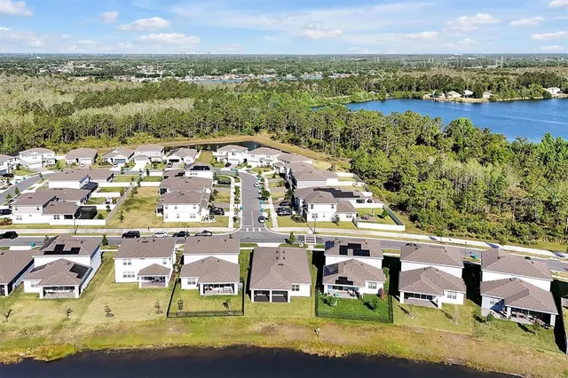 an aerial view of residential houses with outdoor space