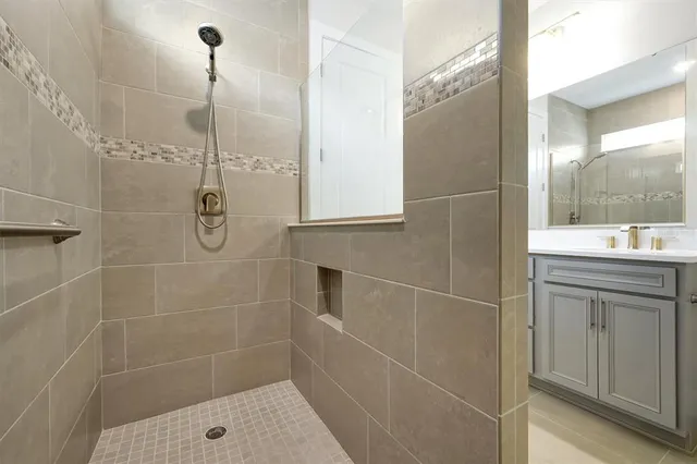 a bathroom with a shower and a sink