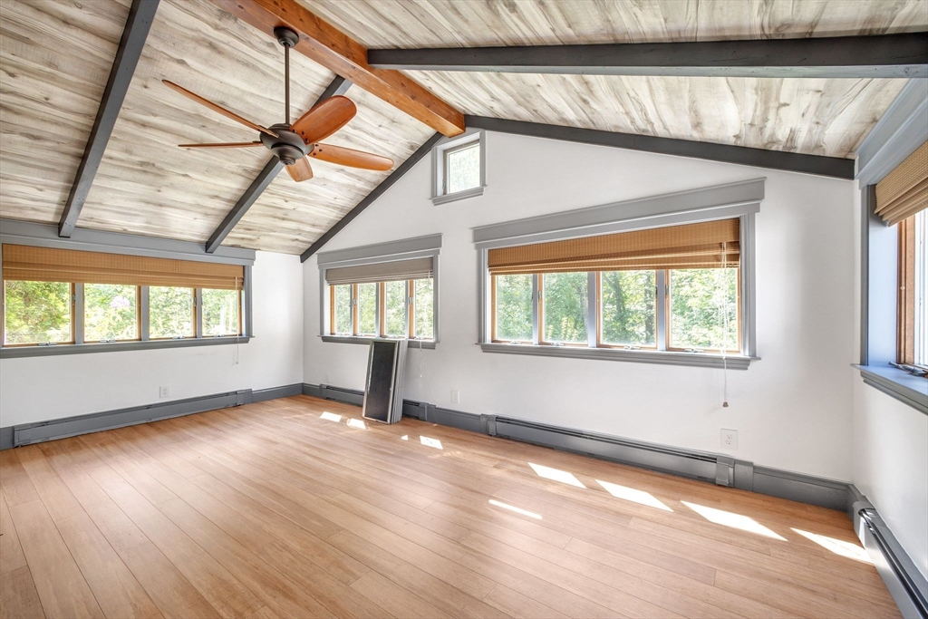 9 Bear Hill Road Billerica, MA 01821 - Photo 8 of 29 a view of an empty room with wooden floor and a window