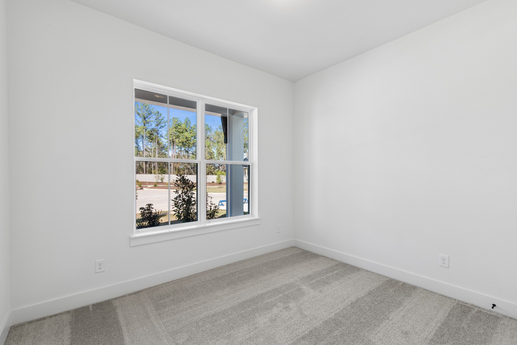 16138 Rita Road Conroe, TX 77302 - Photo 14 of 50 an empty room with a window