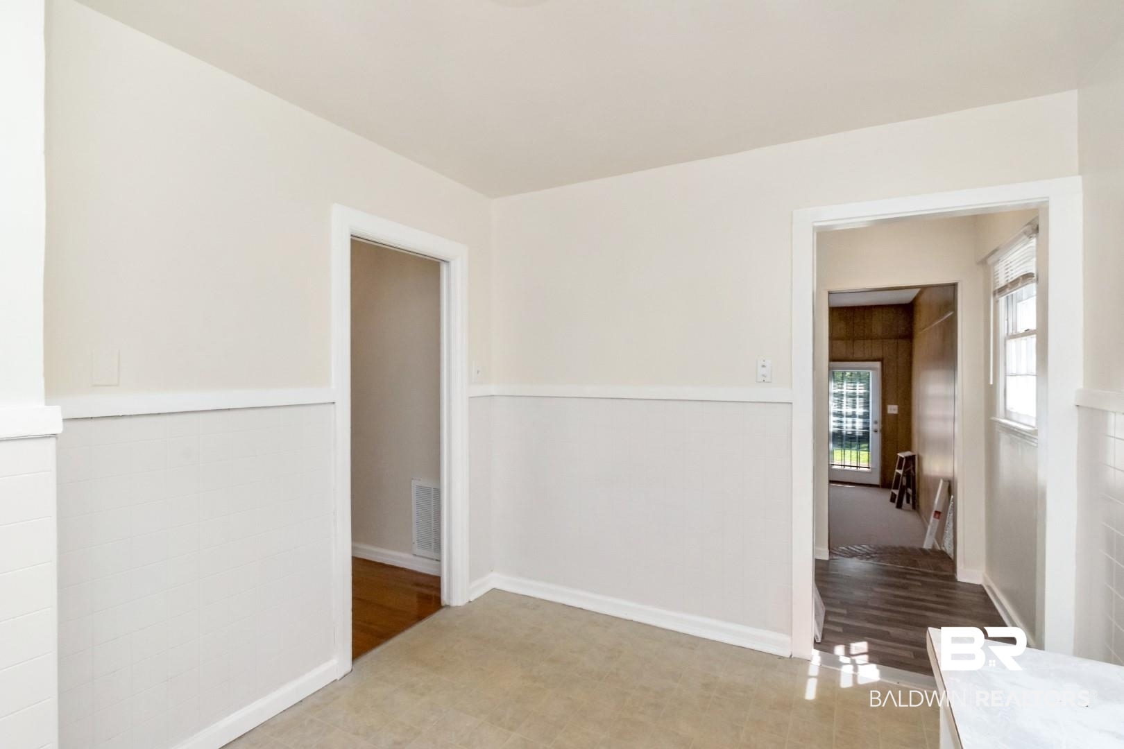 1477 Fairfield Street Mobile, AL 36606 - Photo 18 of 34 Spare room featuring wainscoting and wood finished floors
