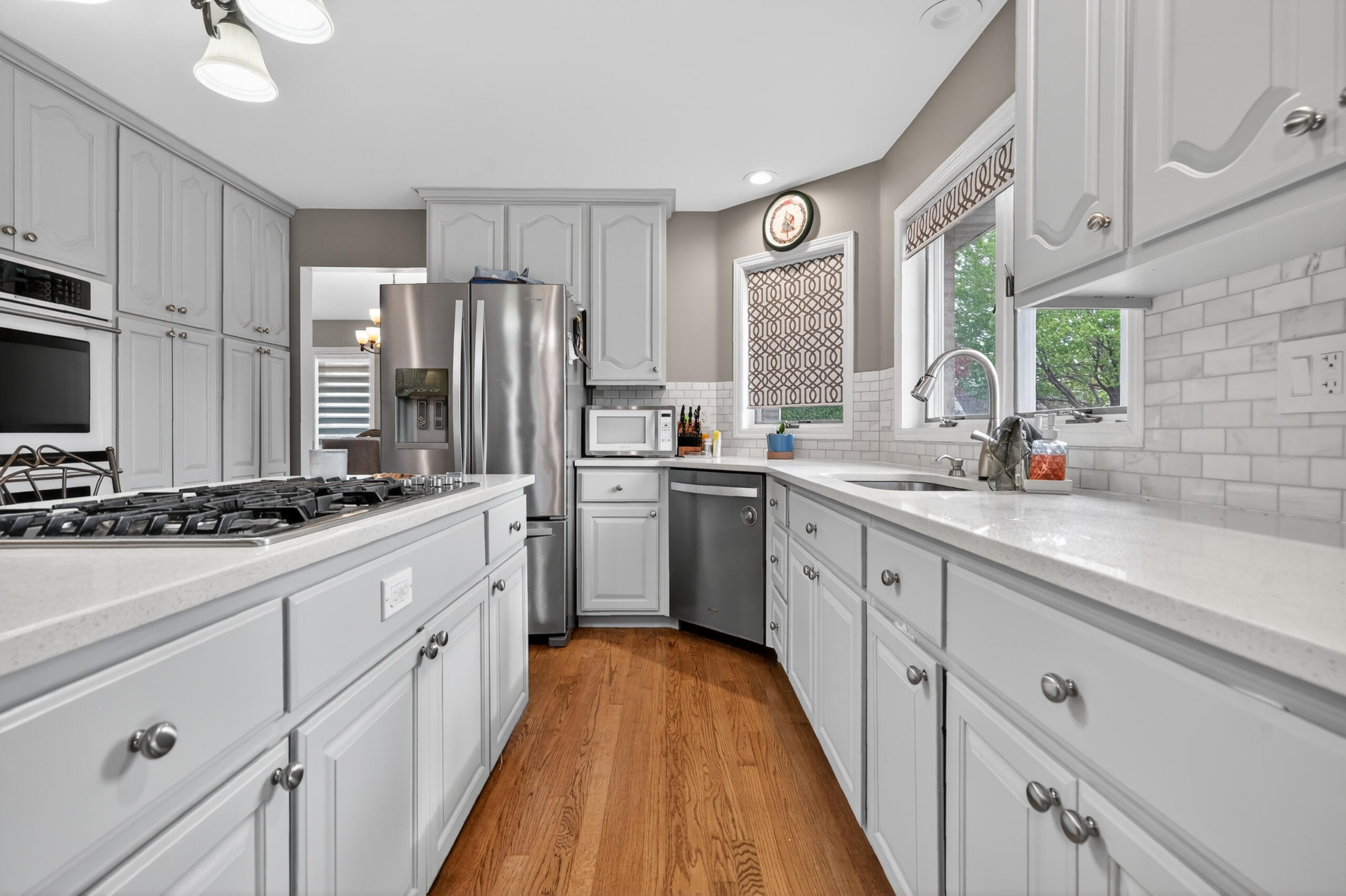 2914 Morningside Drive Crown Point, IN 46307 - Photo 14 of 41 a kitchen with white cabinets and appliances