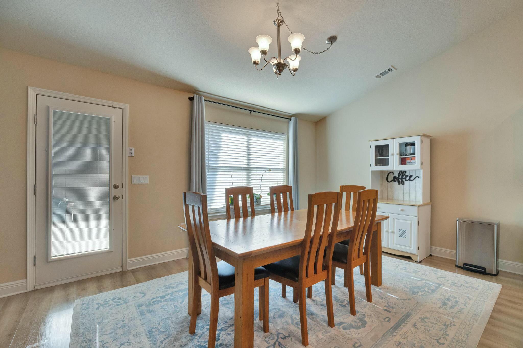 3278 Main Street Navarre, FL 32566 - Photo 19 of 43 a view of a dining room with furniture and window