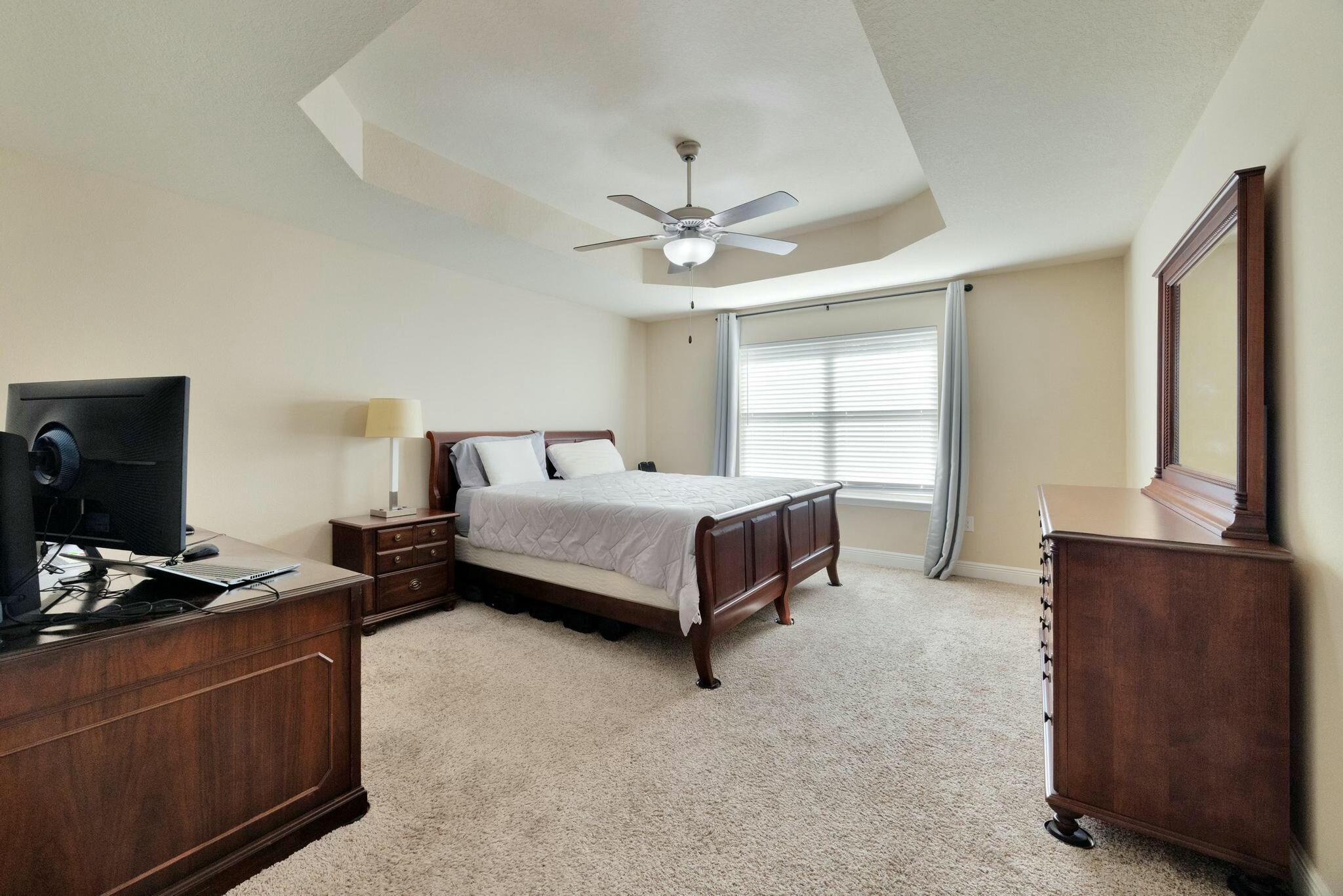 3278 Main Street Navarre, FL 32566 - Photo 20 of 43 a bedroom with a bed and a window