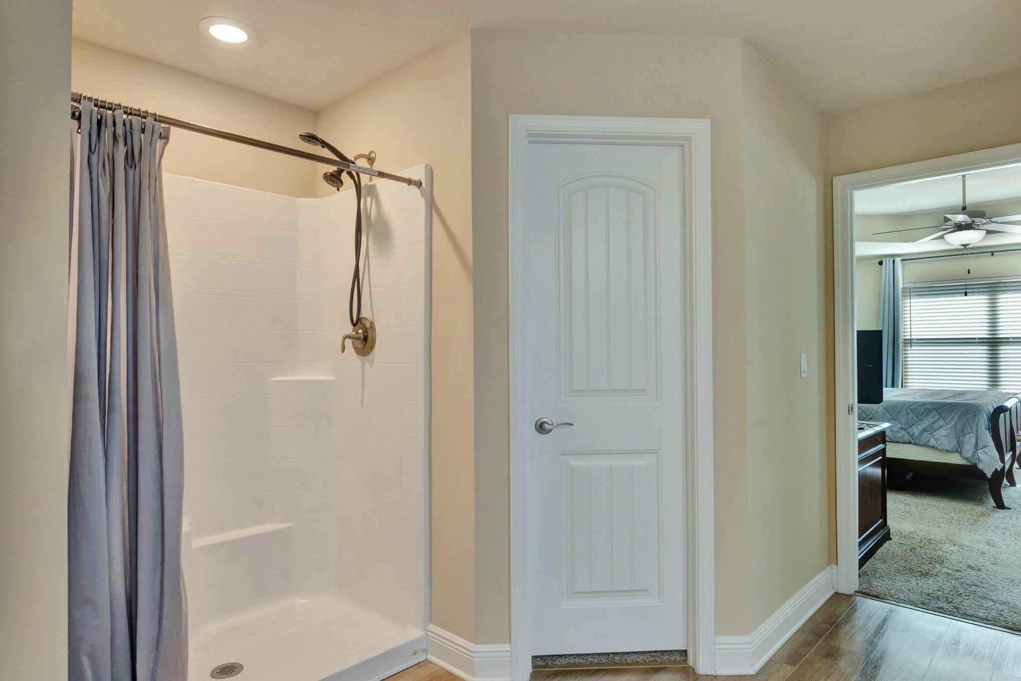 3278 Main Street Navarre, FL 32566 - Photo 25 of 43 a bathroom with a shower and a bath room