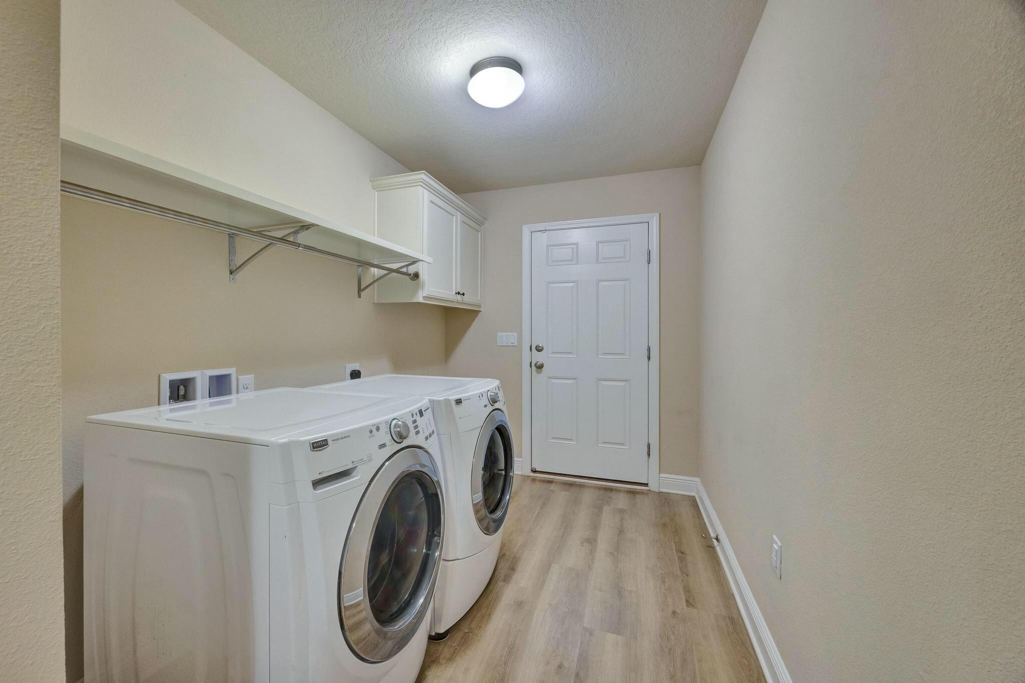 3278 Main Street Navarre, FL 32566 - Photo 31 of 43 a utility room with dryer and washer