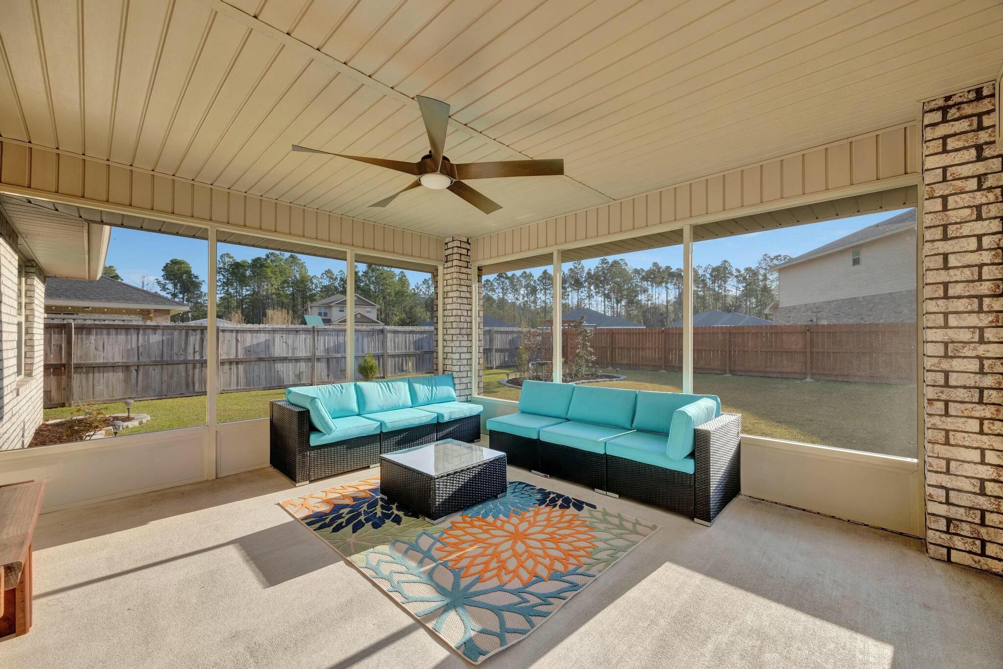 3278 Main Street Navarre, FL 32566 - Photo 32 of 43 a living room with furniture and a large window
