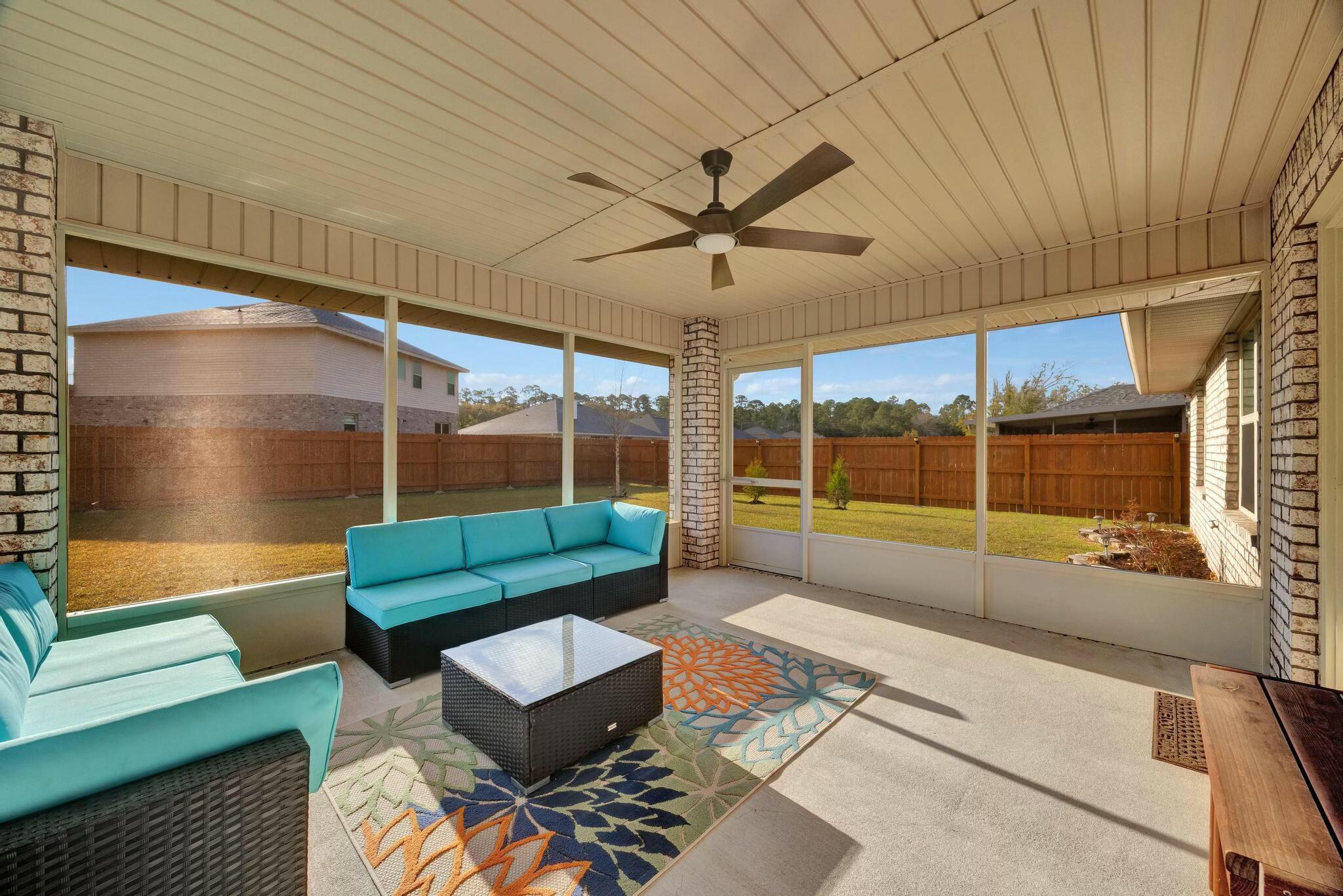 3278 Main Street Navarre, FL 32566 - Photo 33 of 43 a living room with furniture and a large window