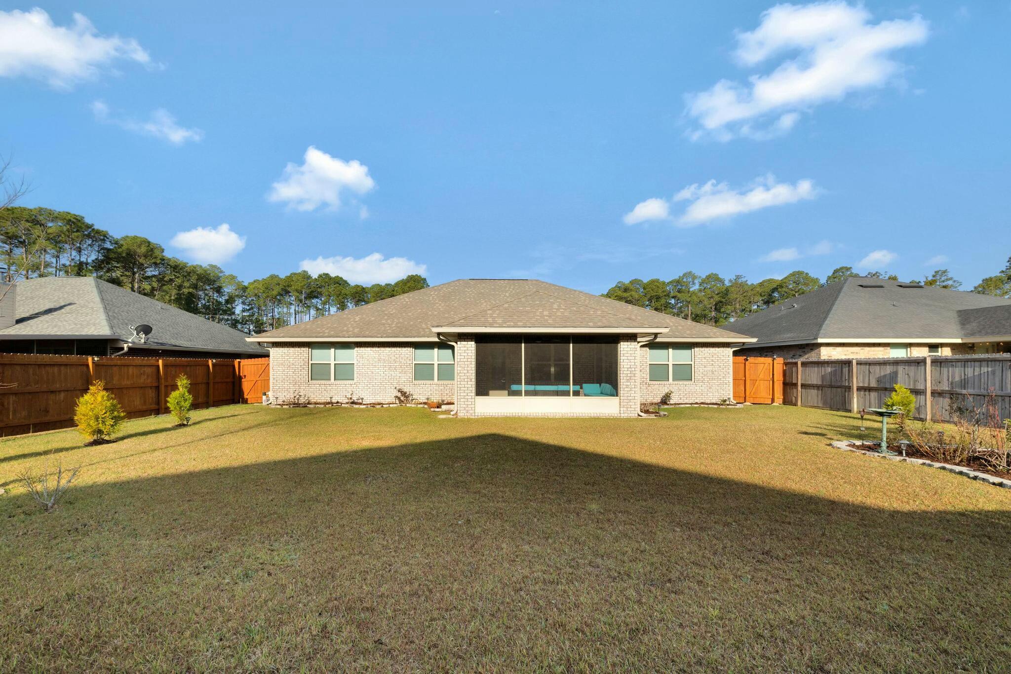3278 Main Street Navarre, FL 32566 - Photo 34 of 43 a view of house with outdoor space and sitting area