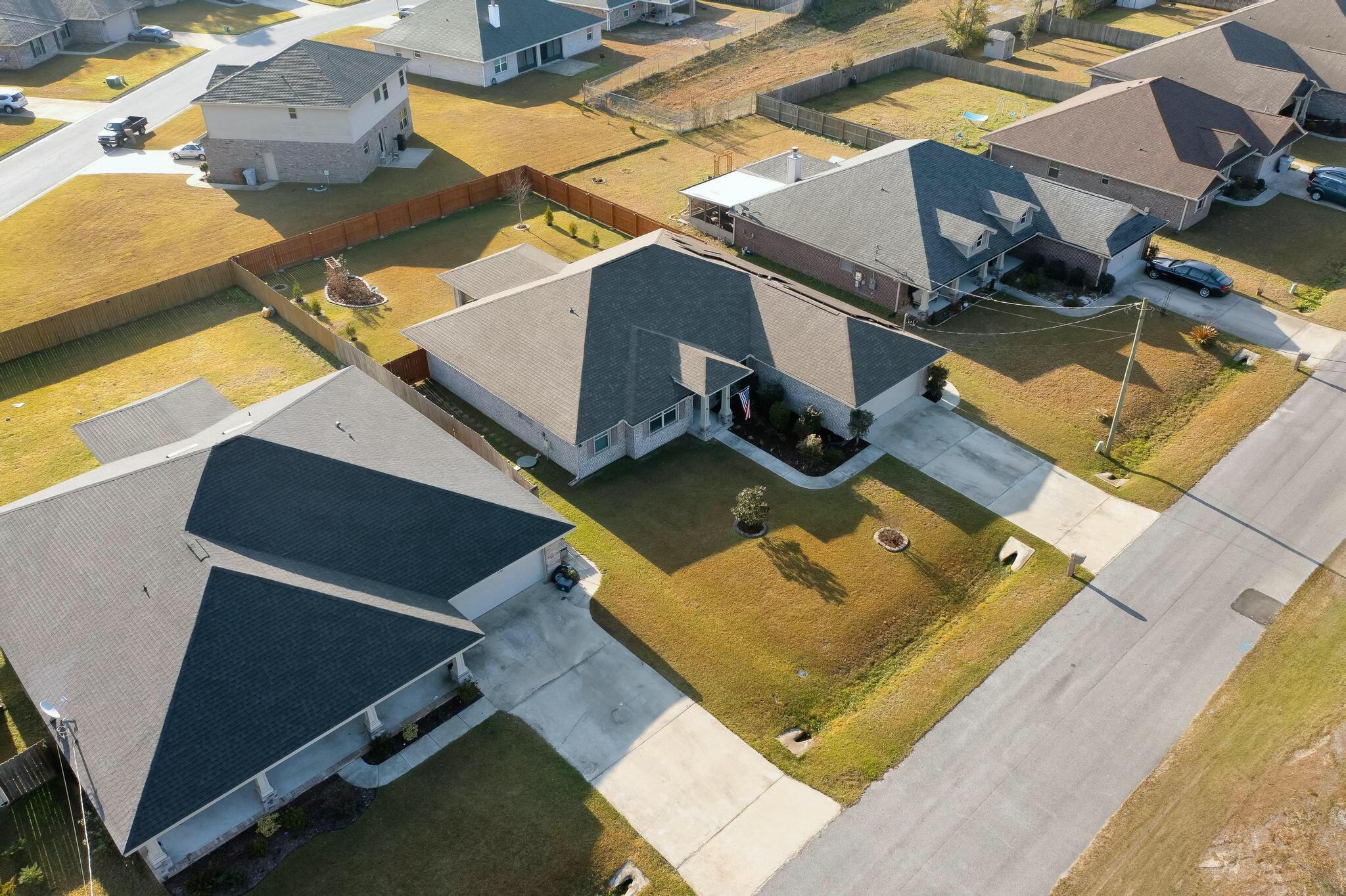 3278 Main Street Navarre, FL 32566 - Photo 39 of 43 an aerial view of a house with a swimming pool
