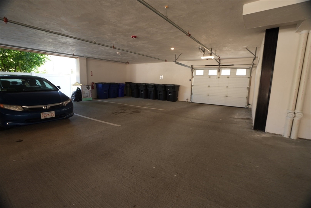 173 Magnolia Street, Unit 1 Boston, MA 02125 - Photo 9 of 9 a car that is parked in a parking space