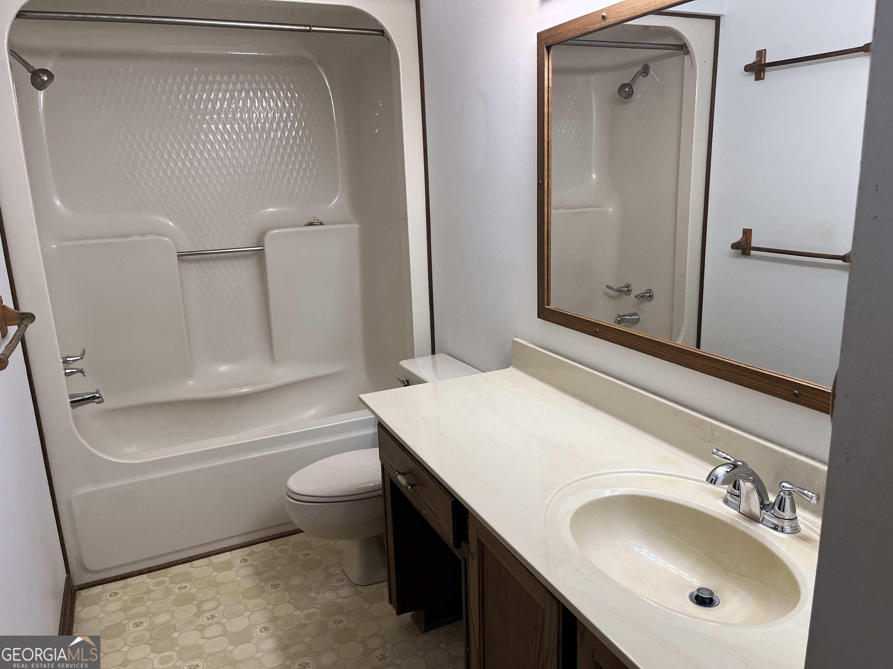 475 Davis Road Southwest Cave Spring, GA 30124 - Photo 15 of 27 a bathroom with a sink a toilet and shower
