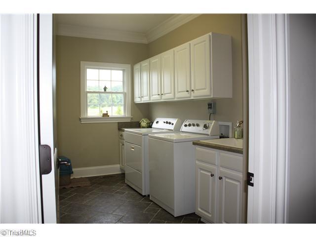 8203 Haw River Road Oak Ridge, NC 27310 - Photo 10 of 16 Laundry Room. Oversized Laundry Room with sink and built-ins