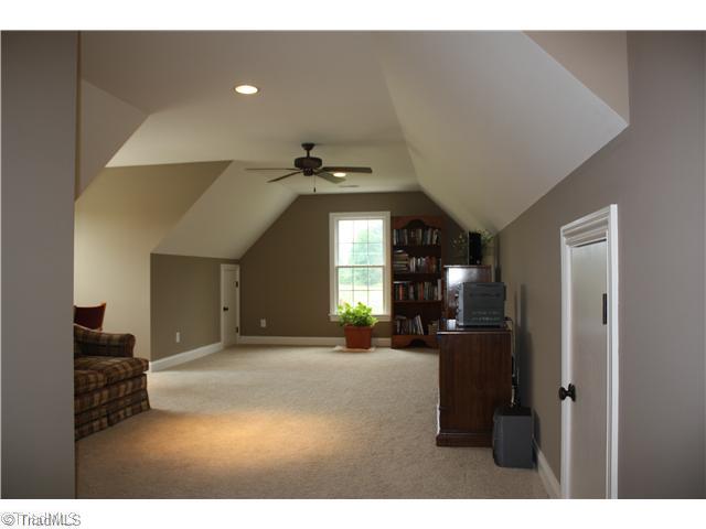 8203 Haw River Road Oak Ridge, NC 27310 - Photo 15 of 16 Bonus. Huge bonus with eve storage on both sides. This home also has a walk in floored attic room with a ladder to additional loft storage.