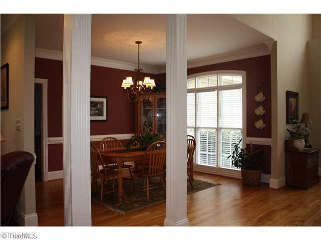 8203 Haw River Road Oak Ridge, NC 27310 - Photo 6 of 16 Dining Room. Large Open Dining Room with tons of light, also featurea a Butler s Pantry for serving.