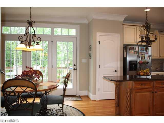 8203 Haw River Road Oak Ridge, NC 27310 - Photo 8 of 16 Breakfast. Eat - in kitchen with 3 glass doors and transoms