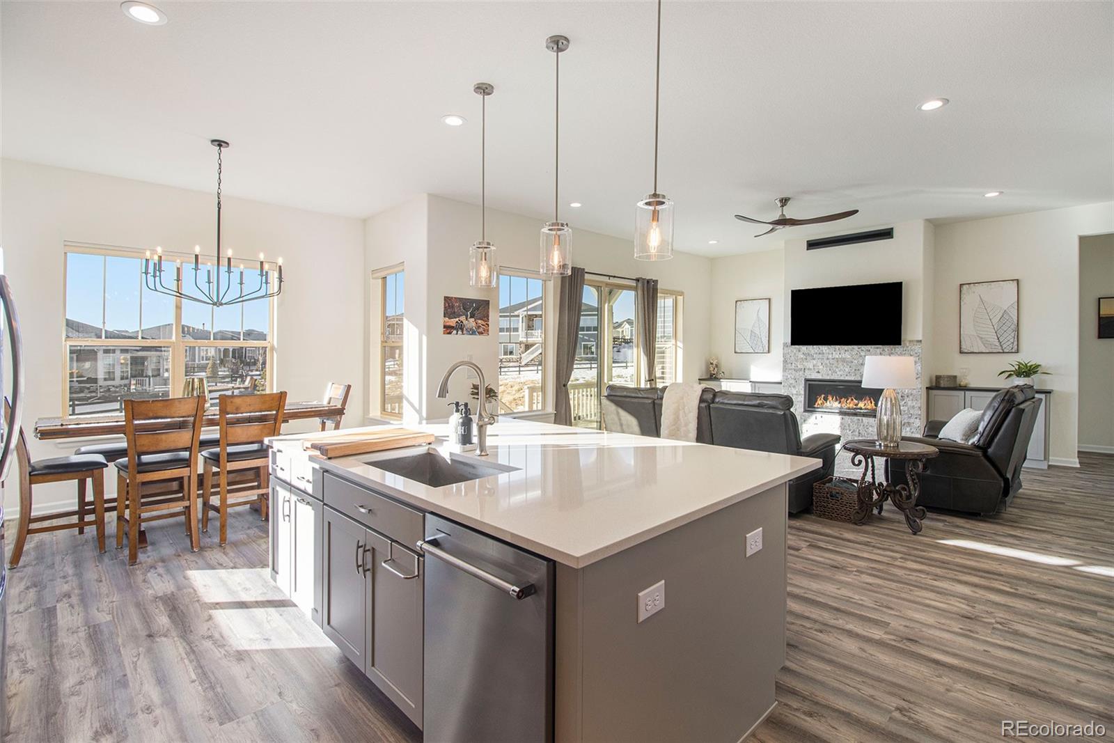 a open kitchen with stainless steel appliances kitchen island a large island in the center