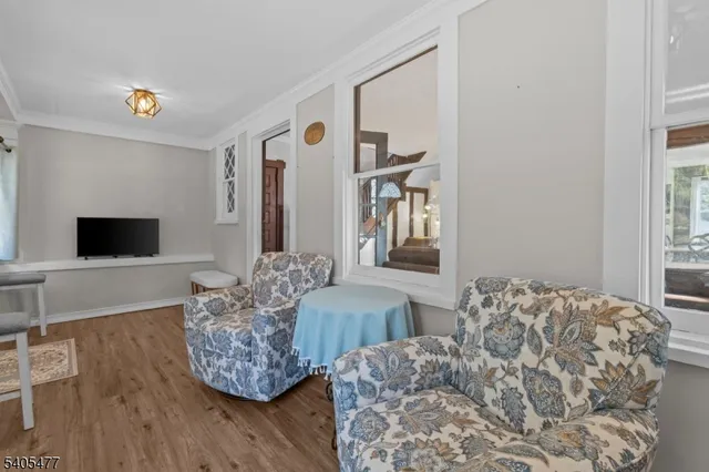 a living room with furniture flat screen tv and a fireplace