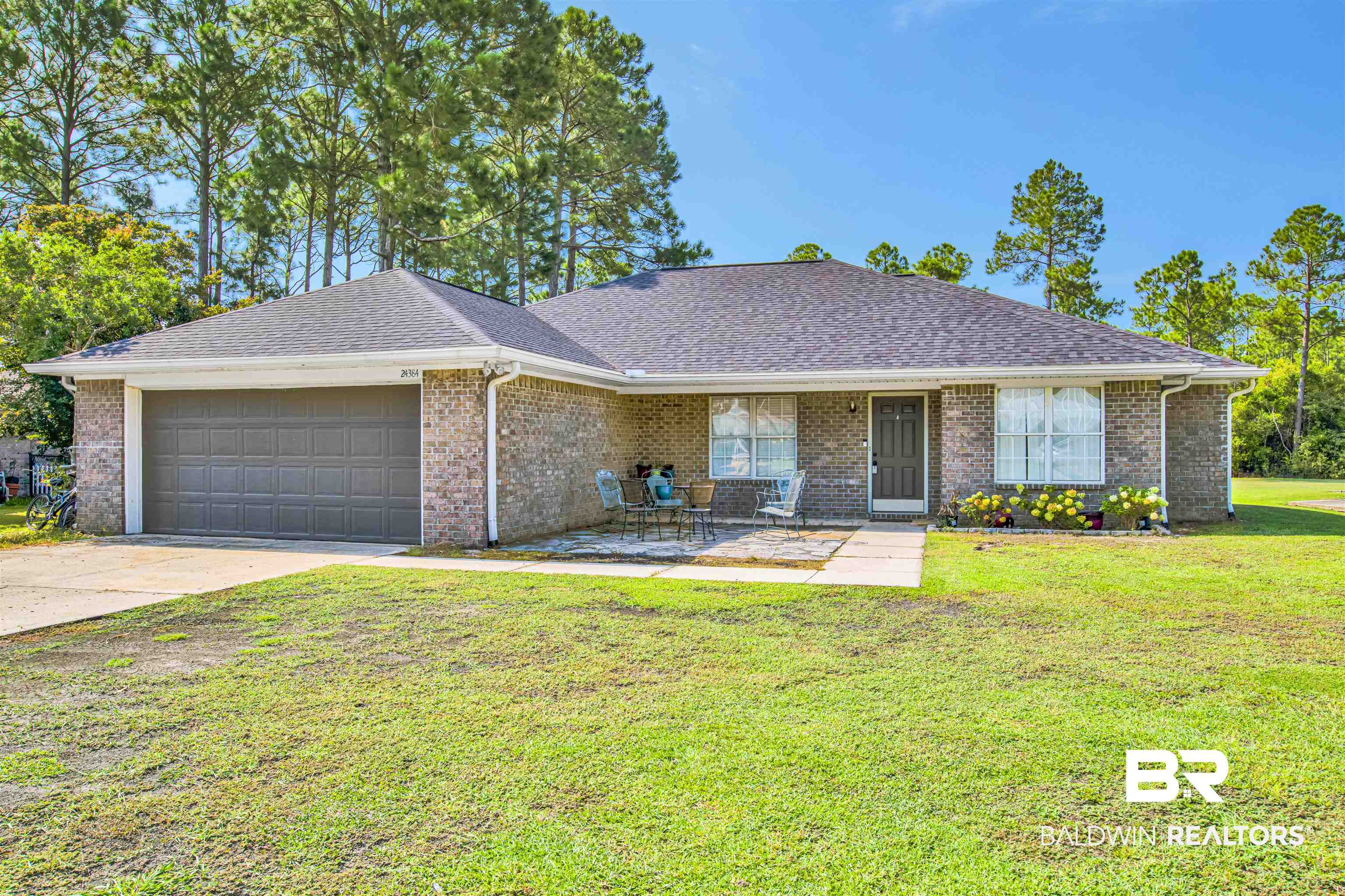 24384 Sailfish Lane Orange Beach, AL 36561 - Photo 2 of 23 Ranch-style home with a garage and a front lawn