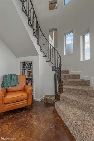 a living room with furniture or stairs and a couch