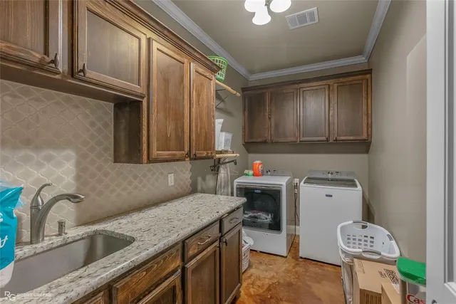a kitchen with a sink cabinets and window