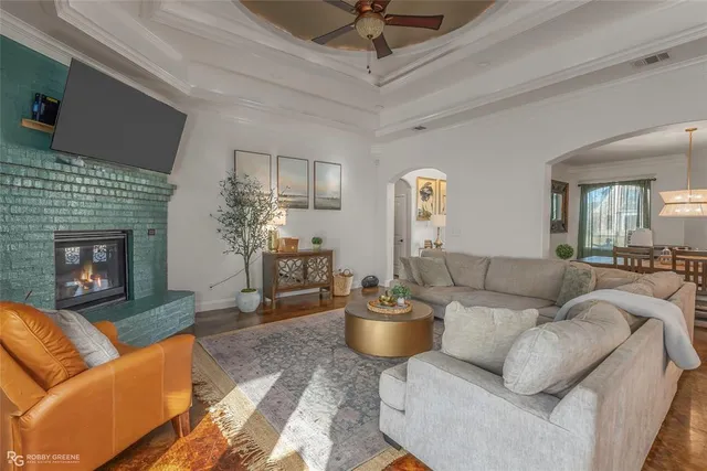 a living room with furniture and a fireplace