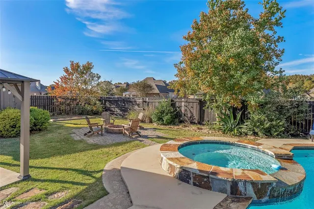 a view of a swimming pool with a patio