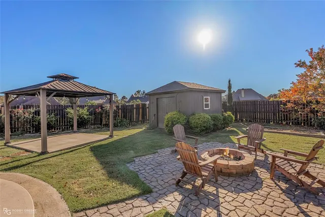 a view of a swimming pool with a lounge chair and floor to ceiling window
