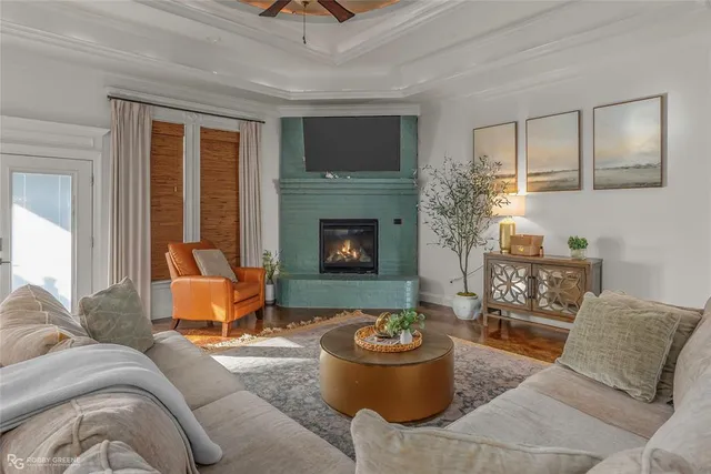 a living room with furniture and a fireplace