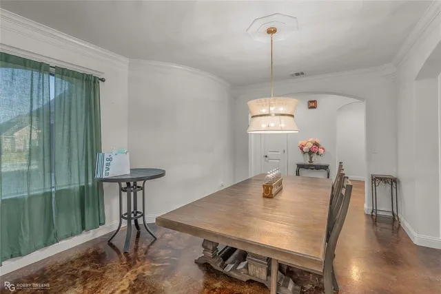 a dining room with furniture and a table
