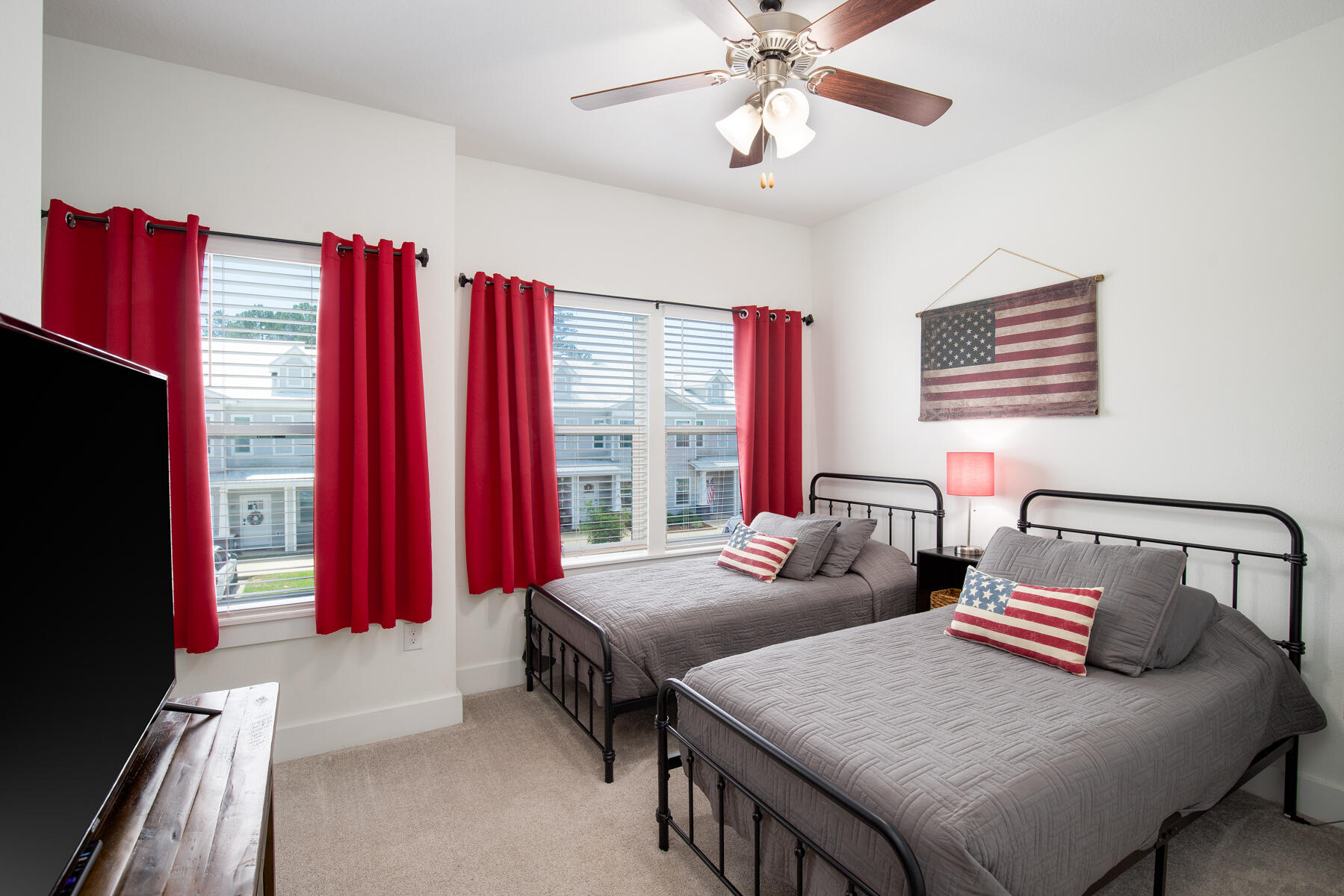 148 North Sand Palm Road Freeport, FL 32439 - Photo 13 of 17 a bedroom with two beds and a chandelier