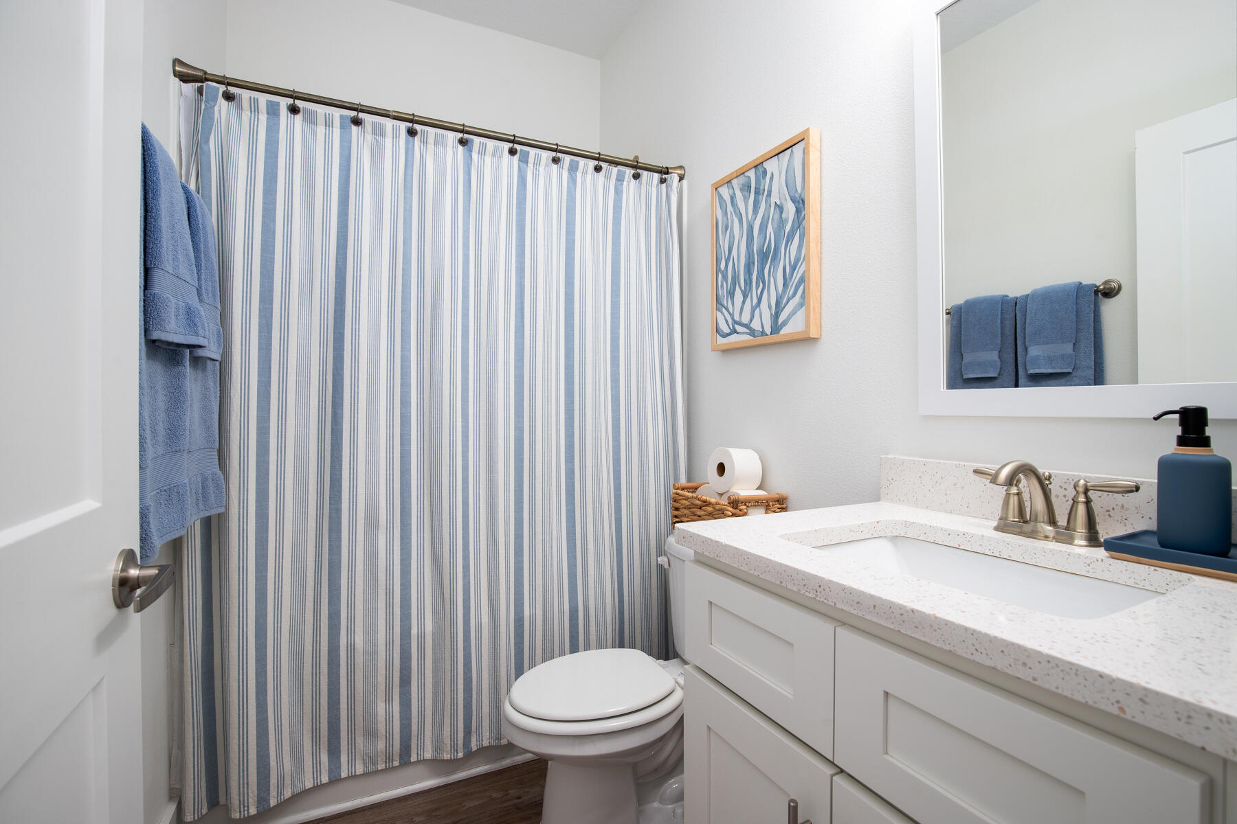 148 North Sand Palm Road Freeport, FL 32439 - Photo 14 of 17 a bathroom with a sink a toilet and a mirror