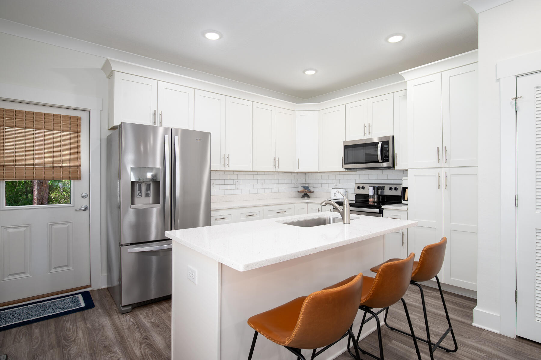 148 North Sand Palm Road Freeport, FL 32439 - Photo 7 of 17 a kitchen with stainless steel appliances a refrigerator stove microwave and sink