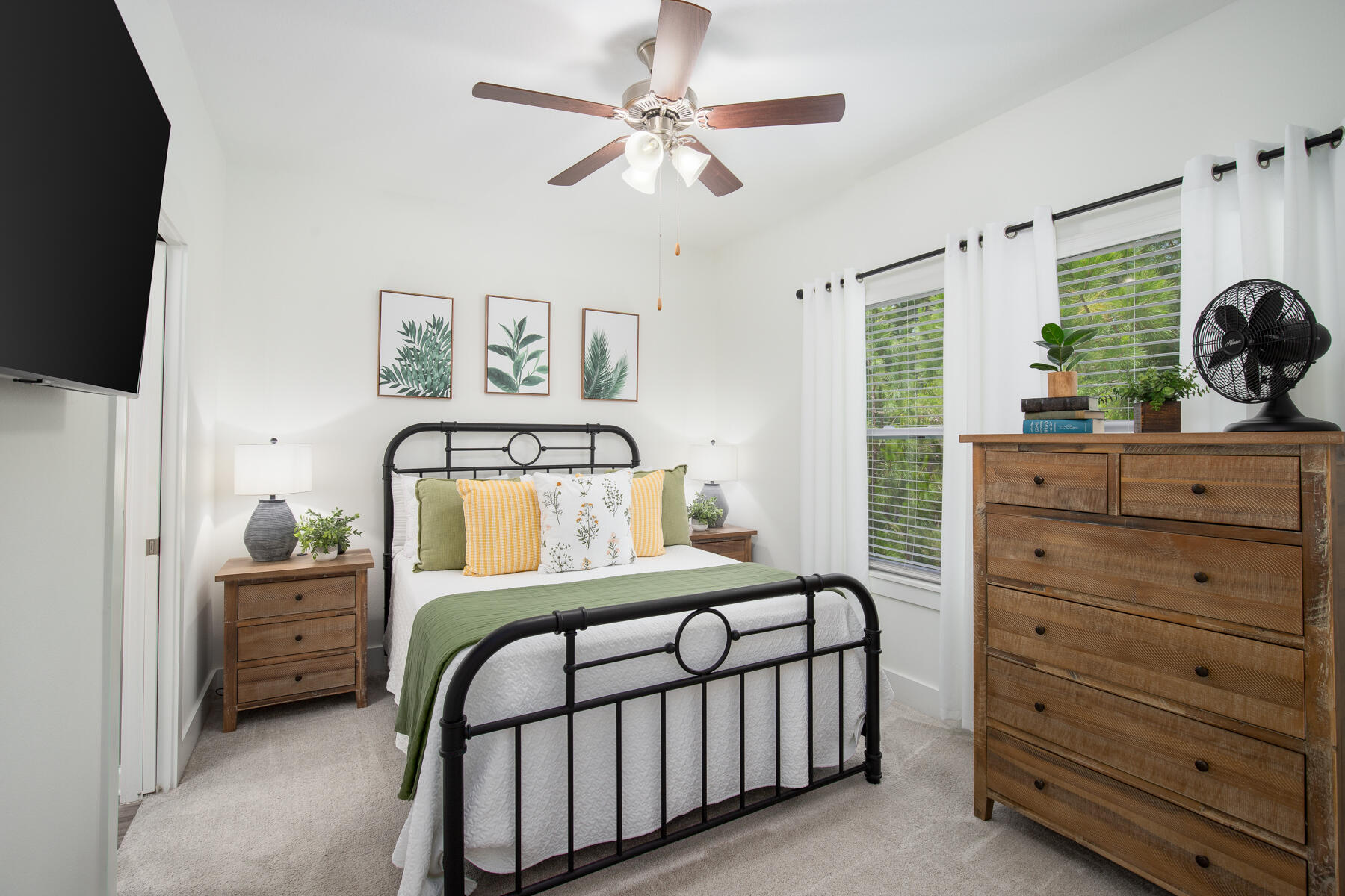 148 North Sand Palm Road Freeport, FL 32439 - Photo 9 of 17 a bedroom with a bed and a chandelier