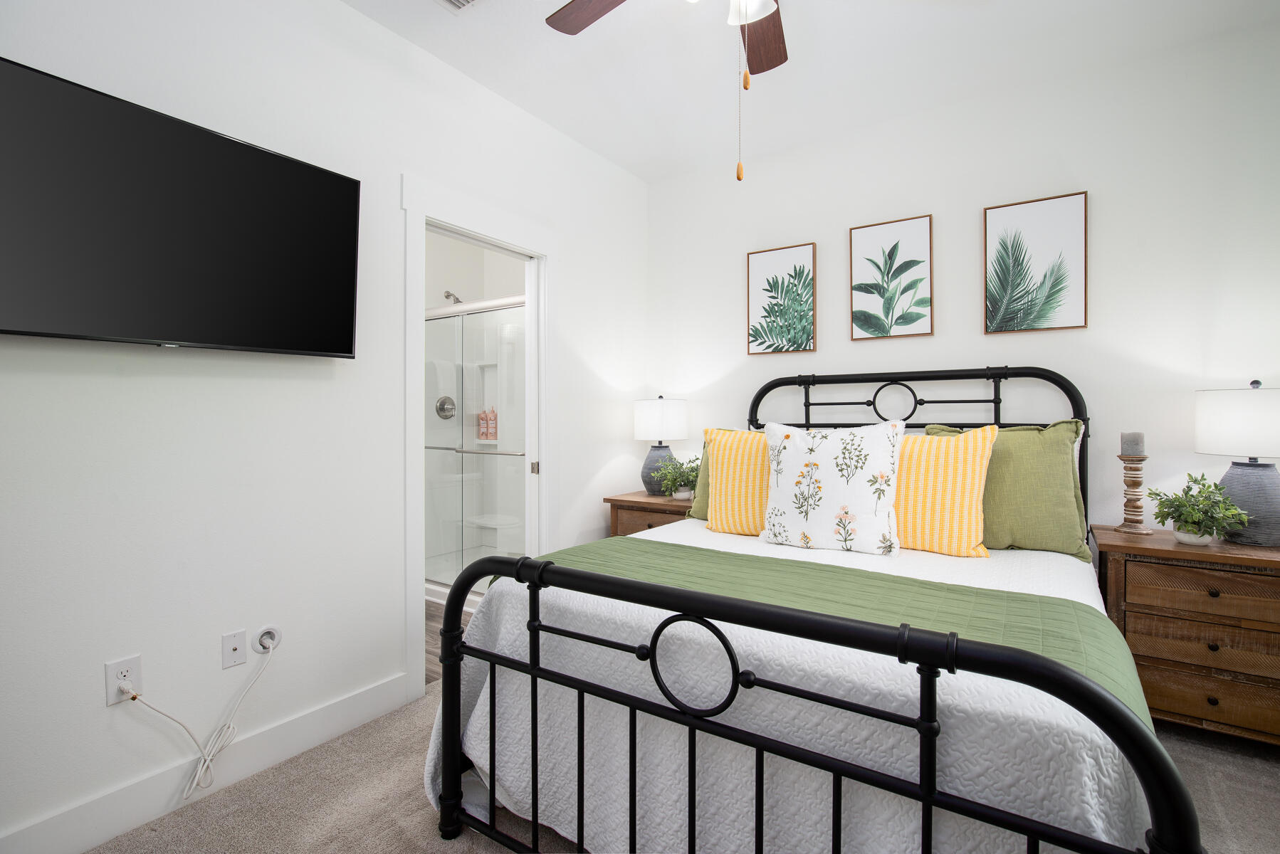 148 North Sand Palm Road Freeport, FL 32439 - Photo 10 of 17 a bedroom with a bed and a flat screen tv