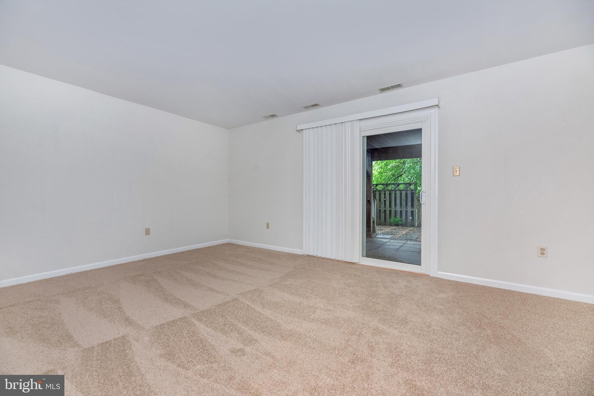 8021 Hollow Reed Court Frederick, MD 21701 - Photo 5 of 55 Main level large rec room with w/out to patio