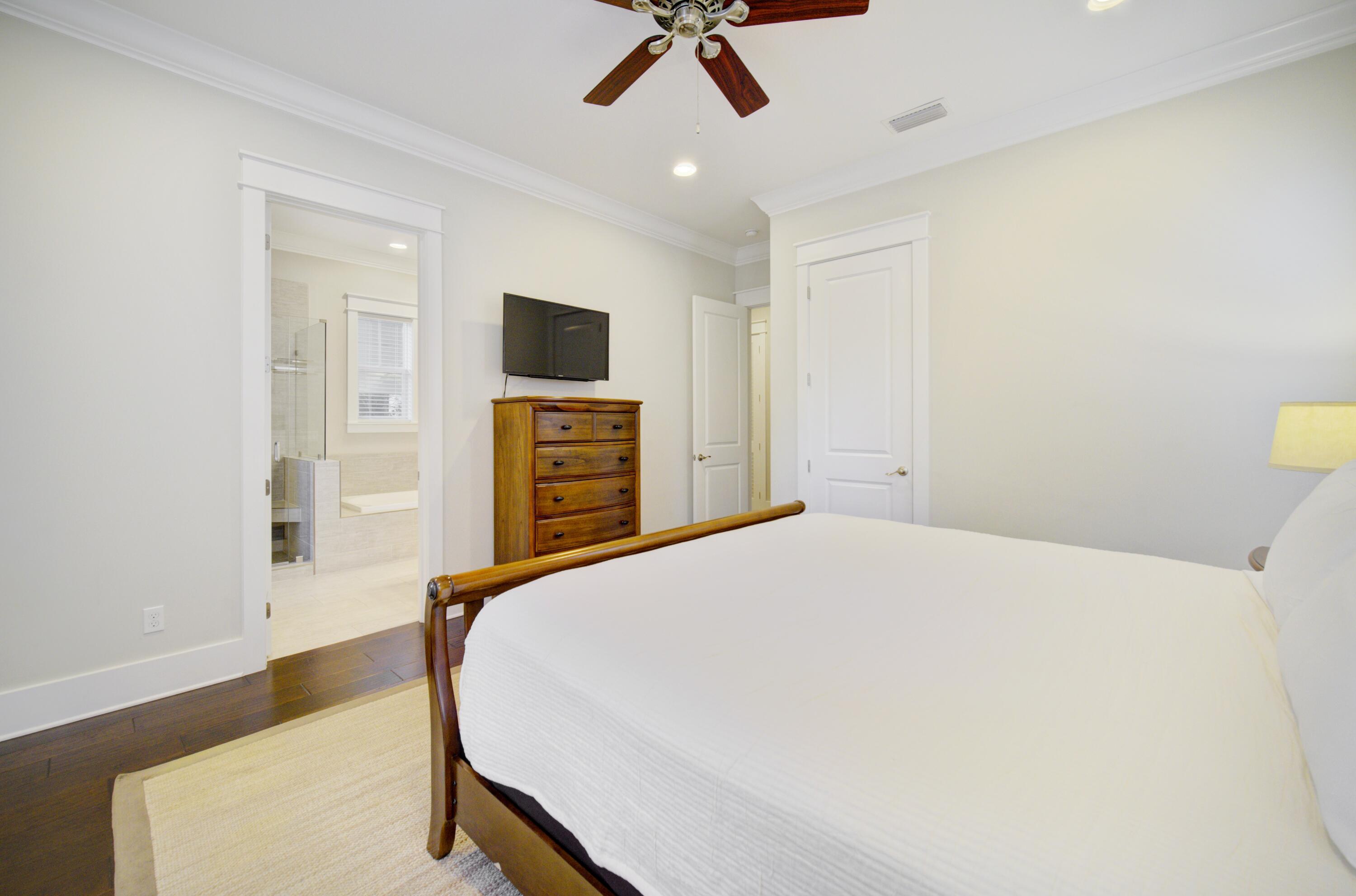 190 Okeechobee West Santa Rosa Beach, FL 32459 - Photo 23 of 71 a bedroom with a bed and a flat screen tv