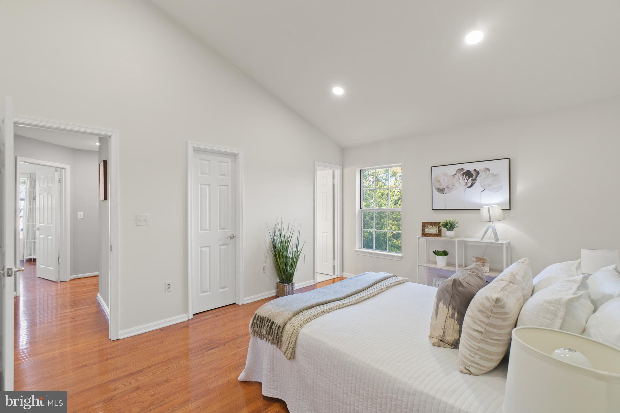 2430 Lyttonsville Road Silver Spring, MD 20910 - Photo 15 of 53 a bedroom with a bed and painting on the wall