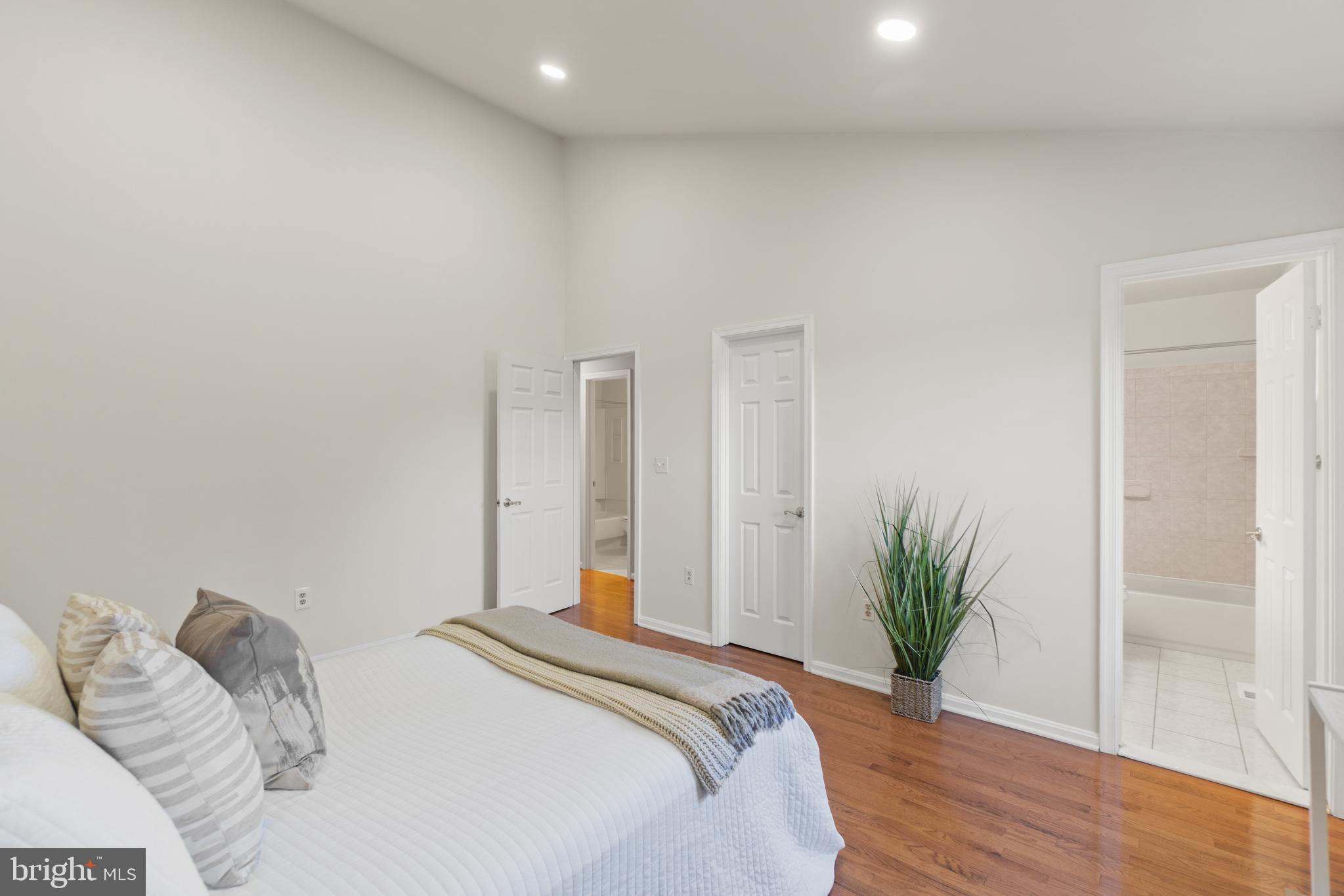 2430 Lyttonsville Road Silver Spring, MD 20910 - Photo 16 of 53 a bedroom with a bed and a potted plant