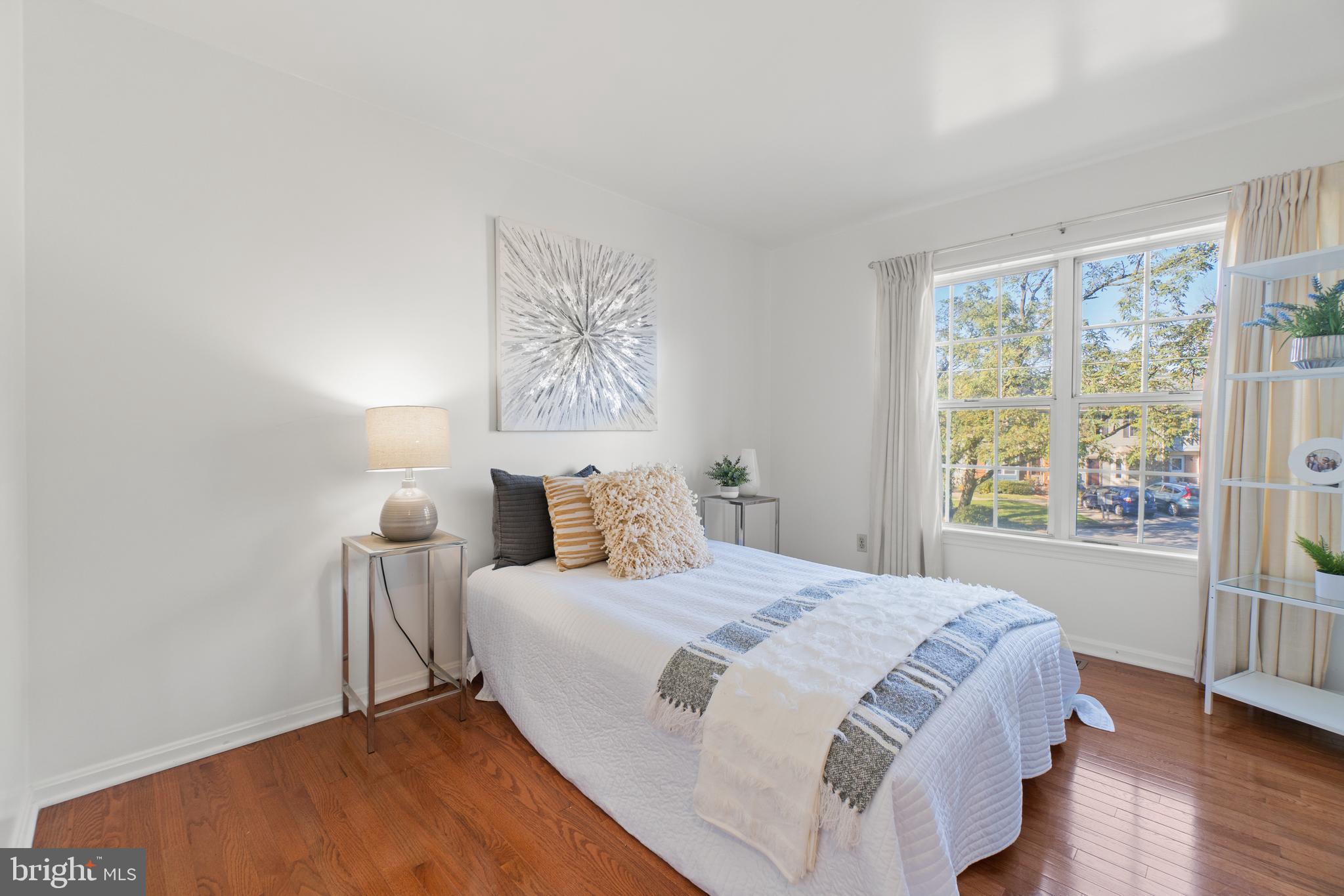 2430 Lyttonsville Road Silver Spring, MD 20910 - Photo 18 of 53 a bedroom with a bed and a large window