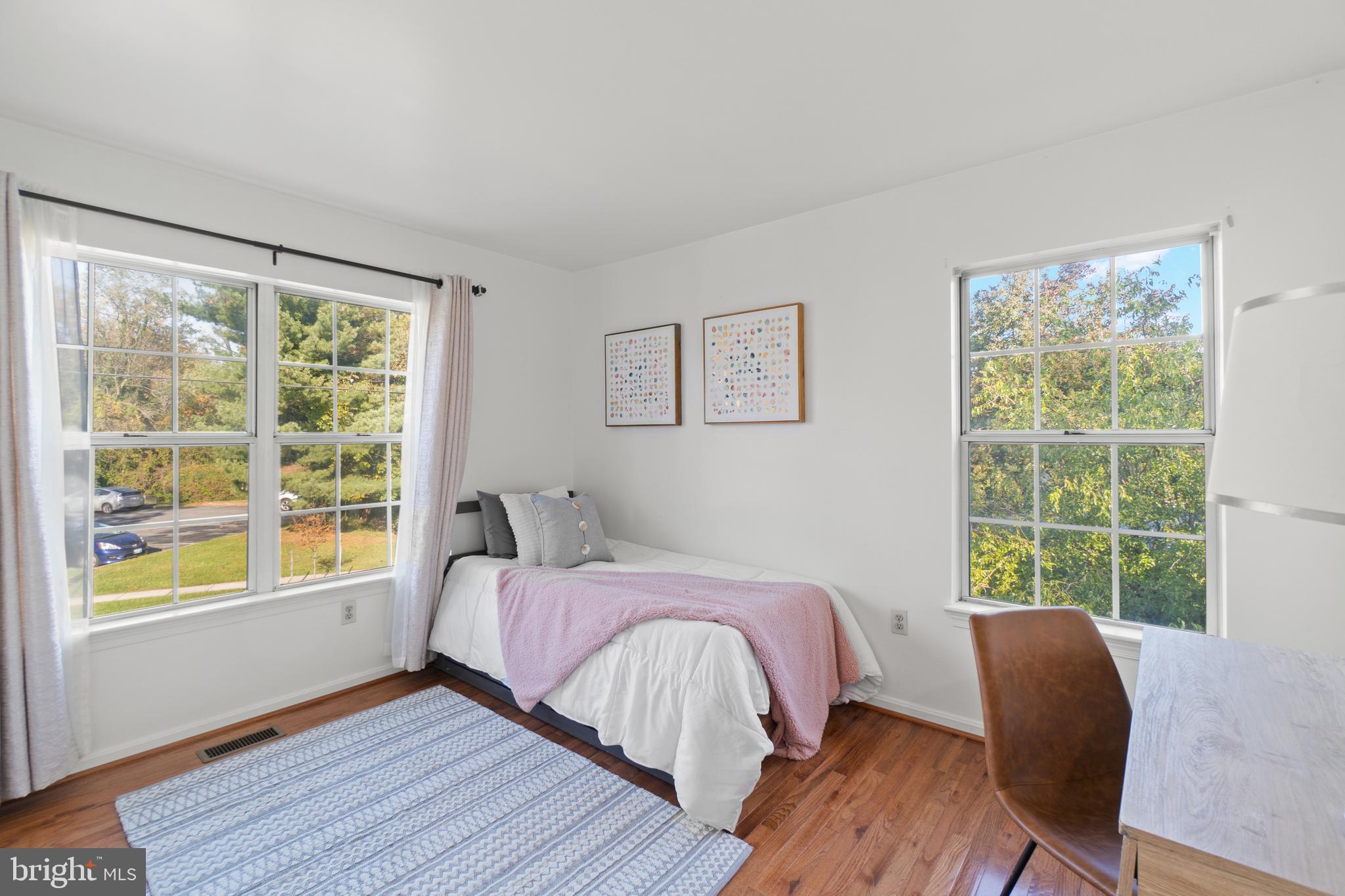 2430 Lyttonsville Road Silver Spring, MD 20910 - Photo 20 of 53 a bedroom with a bed and a window