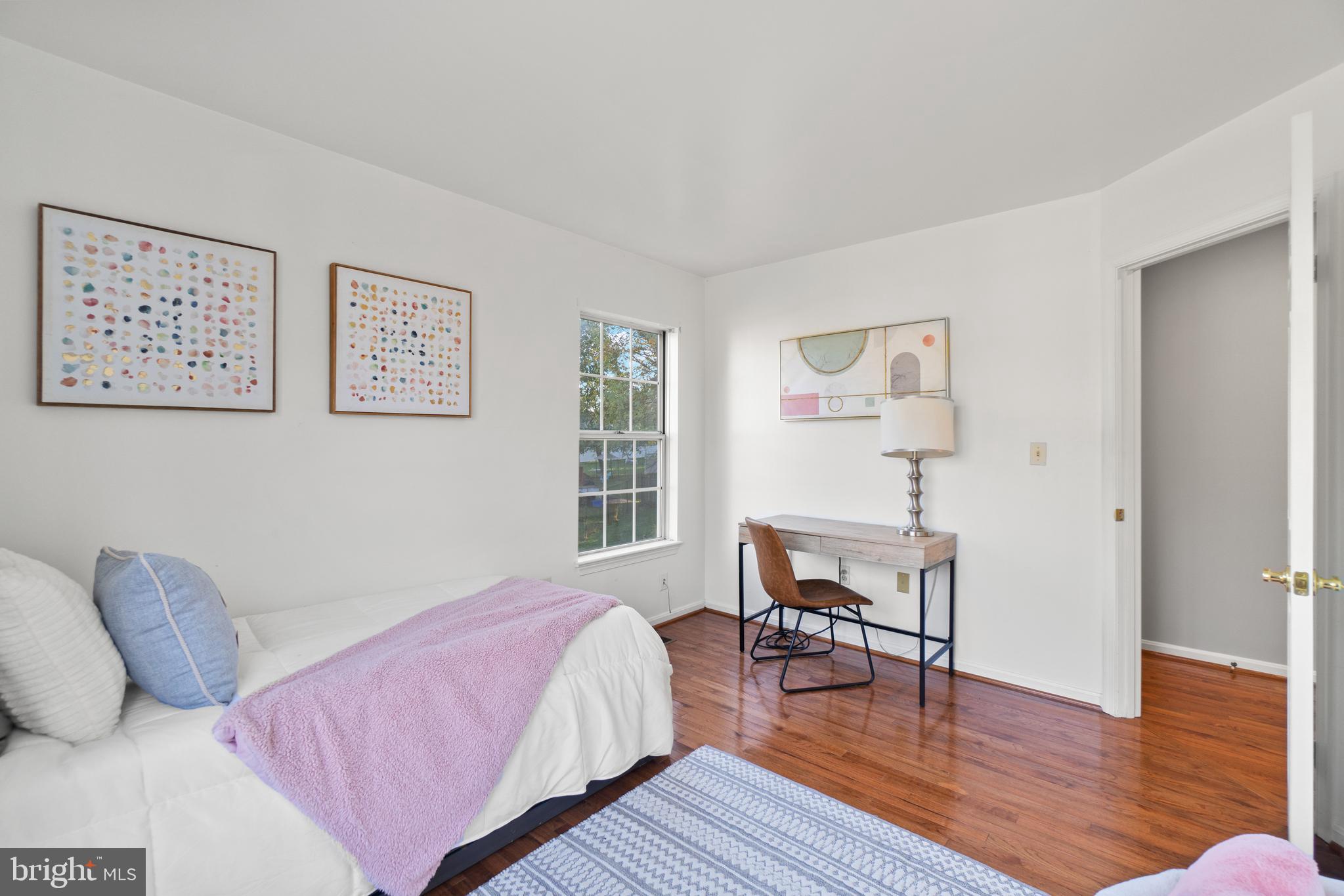 2430 Lyttonsville Road Silver Spring, MD 20910 - Photo 22 of 53 a bedroom with a bed and wooden floor