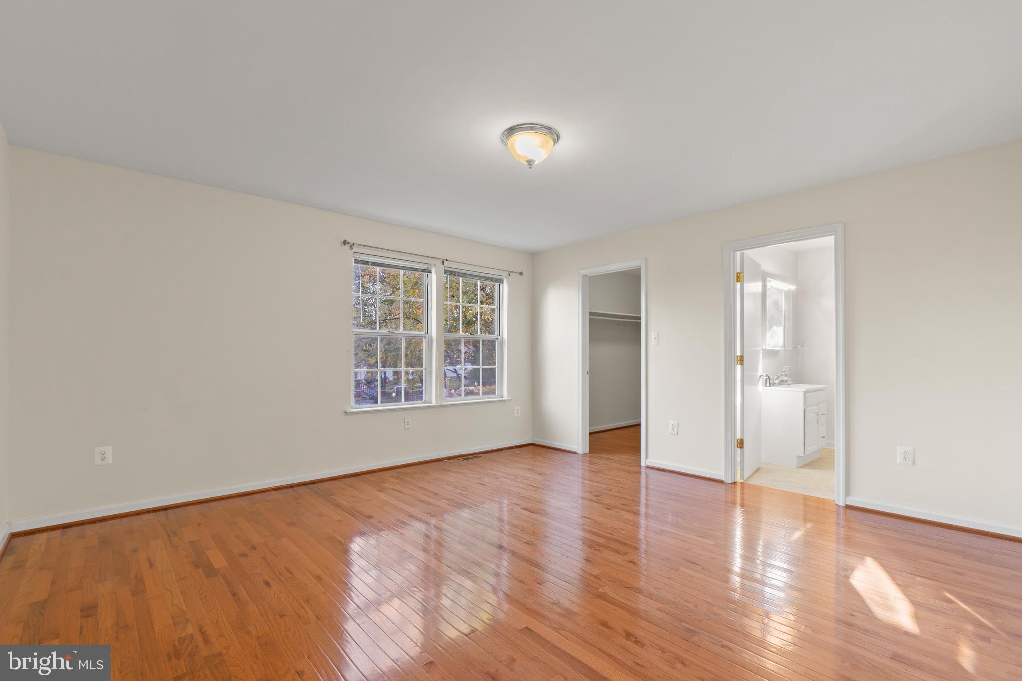 2430 Lyttonsville Road Silver Spring, MD 20910 - Photo 25 of 53 an empty room with wooden floor and windows