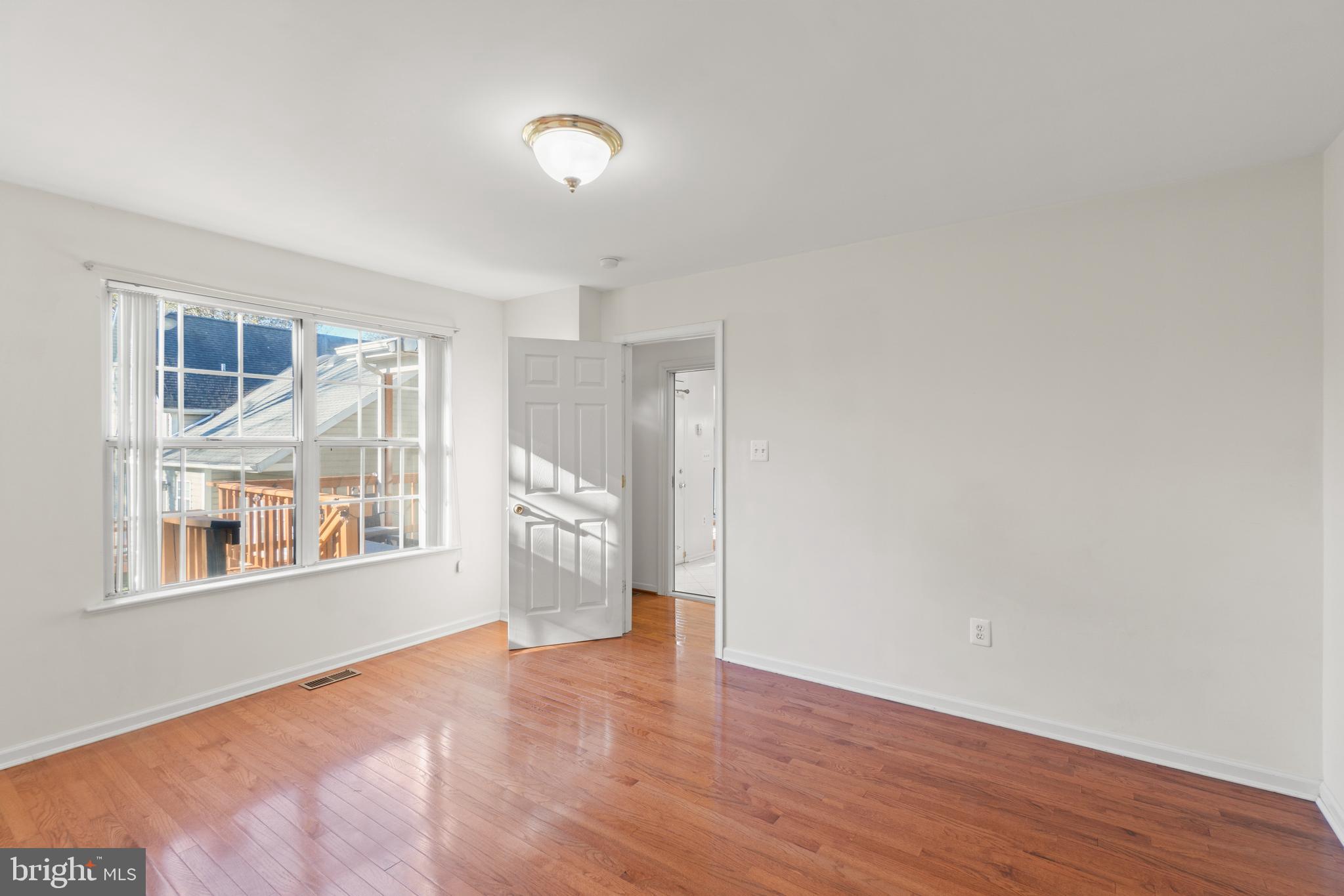 2430 Lyttonsville Road Silver Spring, MD 20910 - Photo 28 of 53 a view of empty room with wooden floor and fan