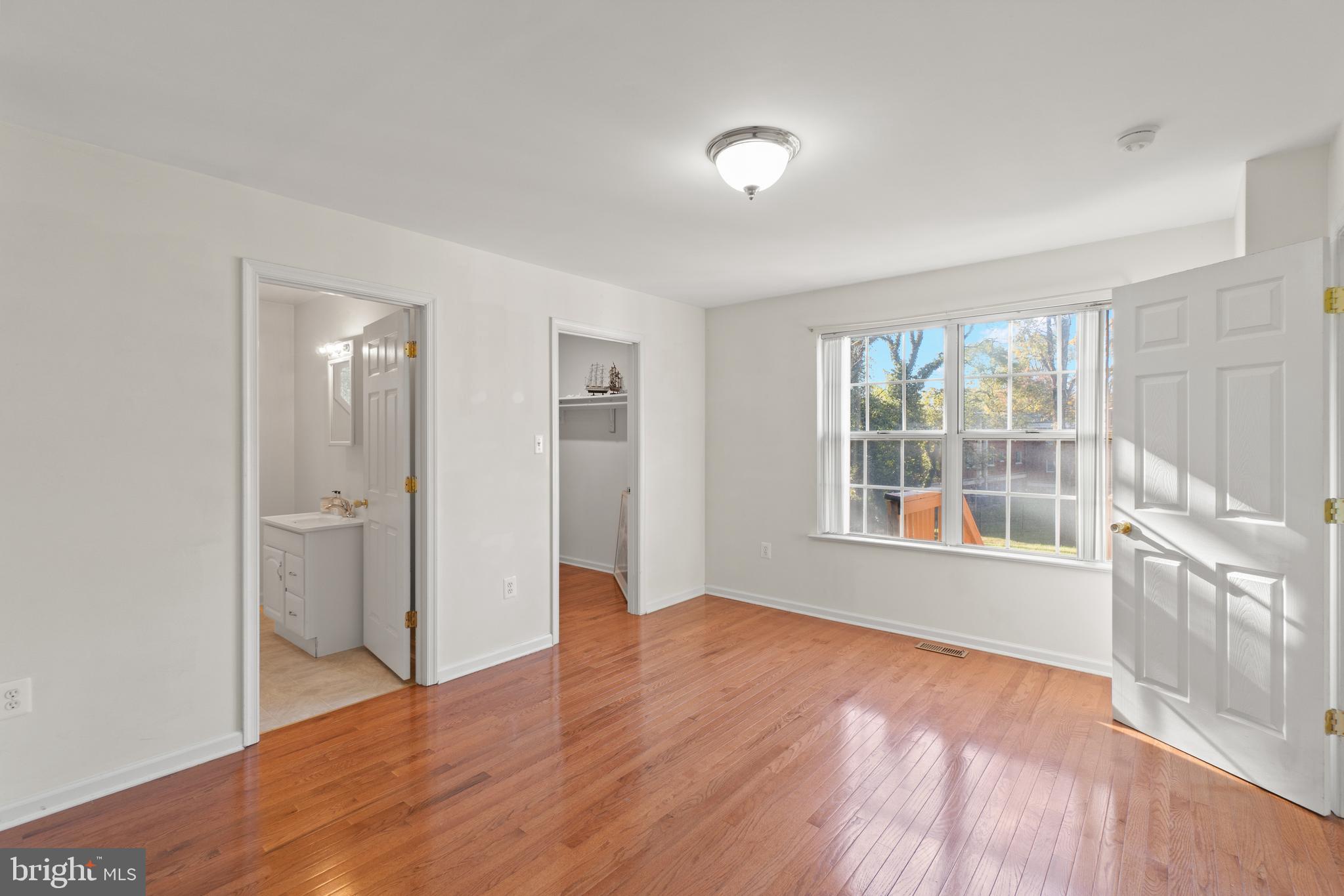 2430 Lyttonsville Road Silver Spring, MD 20910 - Photo 29 of 53 wooden floor in an empty room with a window