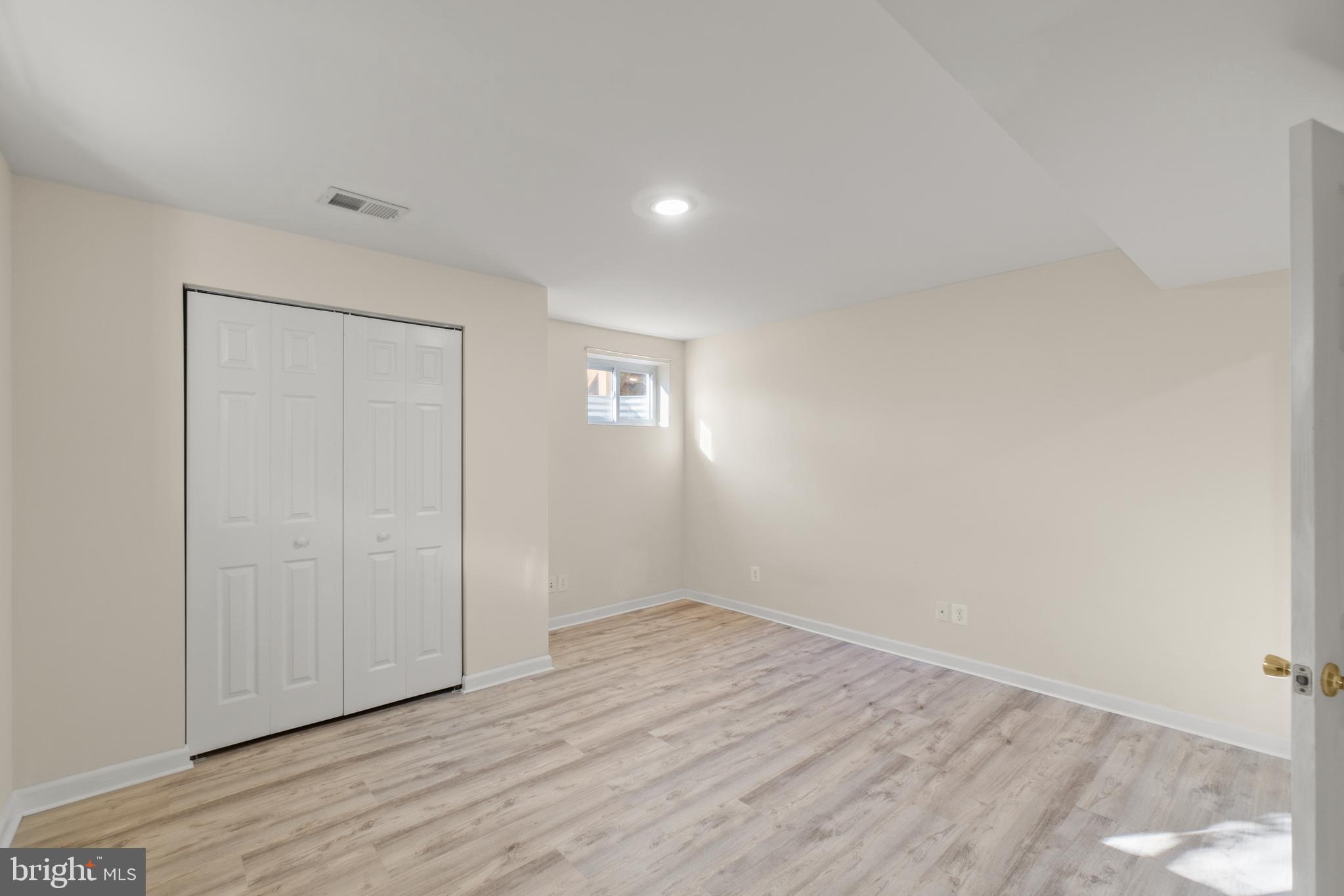 2430 Lyttonsville Road Silver Spring, MD 20910 - Photo 45 of 53 a view of empty room with wooden floor and fan