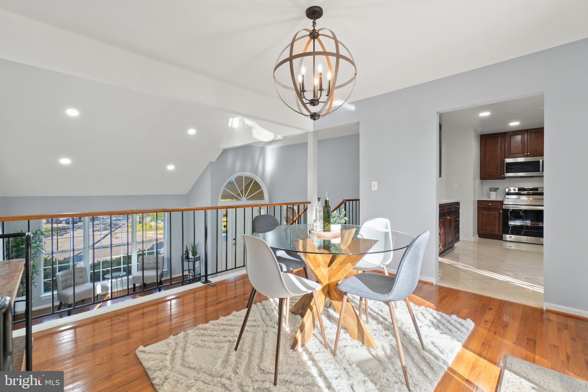 2430 Lyttonsville Road Silver Spring, MD 20910 - Photo 8 of 53 a view of a dining room with furniture wooden floor and chandelier