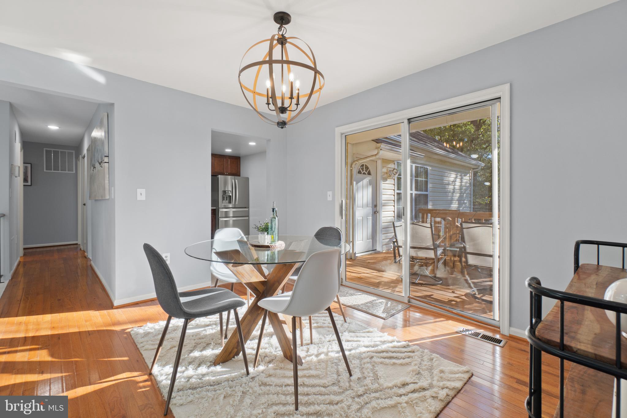 2430 Lyttonsville Road Silver Spring, MD 20910 - Photo 9 of 53 a view of a dining room with furniture wooden floor and chandelier