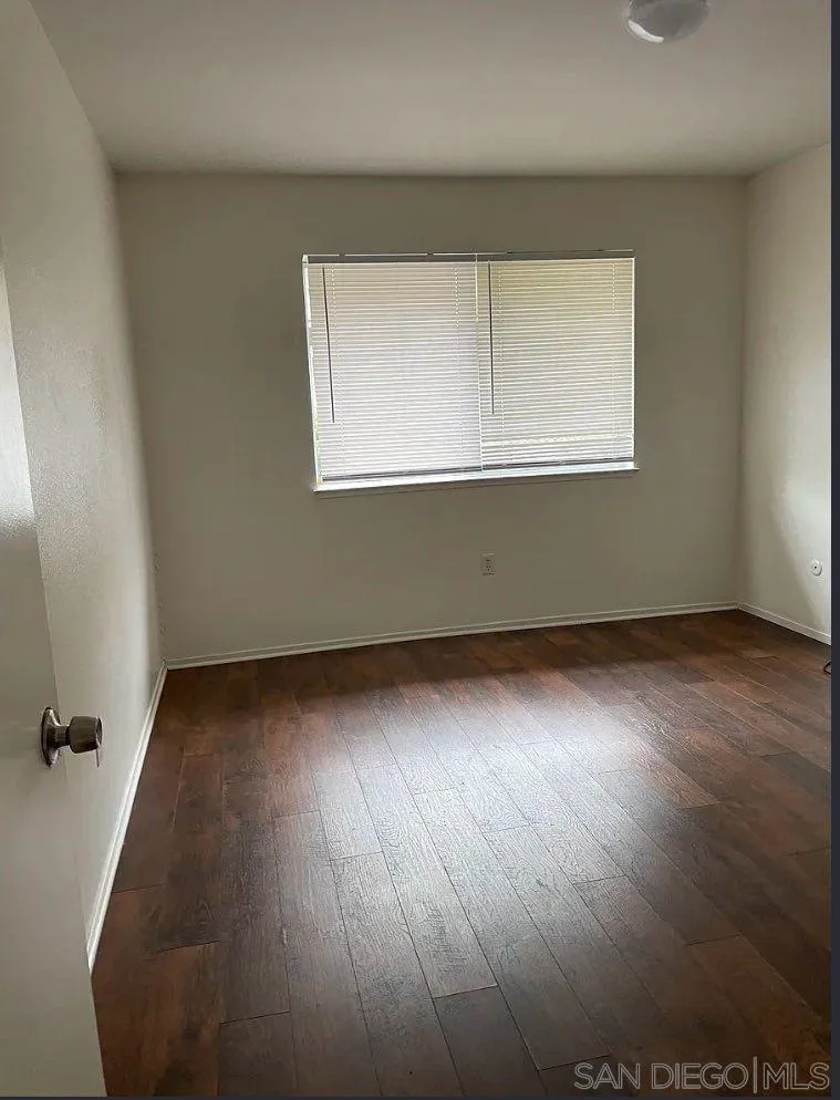 8175 Arthur Street Cotati, CA 94931 - Photo 6 of 10 an empty room with wooden floor and windows